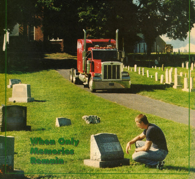 "When Only Memories Remain:" a young man crouches pensively next to a headstone, touching it. In the background, a red tractor trailer cab looms.
