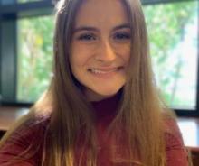 Brunette woman smiling.