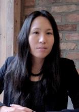 A front-facing portrait of poet Lee Jenny