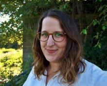 photo of woman with medium-length brown hair and glasses